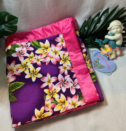 100% cotton Aloha print purple and bubble gum pink satin trim baby blanket