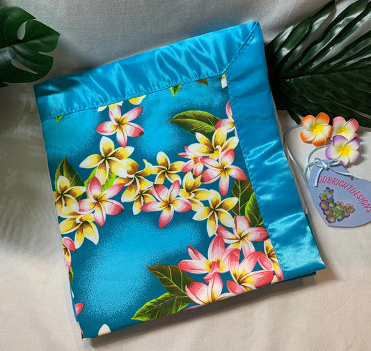 Plumeria Print 100% cotton baby blanket with satin trim