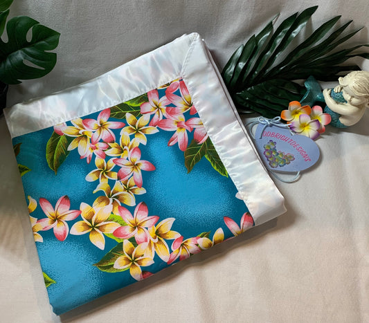 100% cotton cyan blue plumeria print with a satin trim