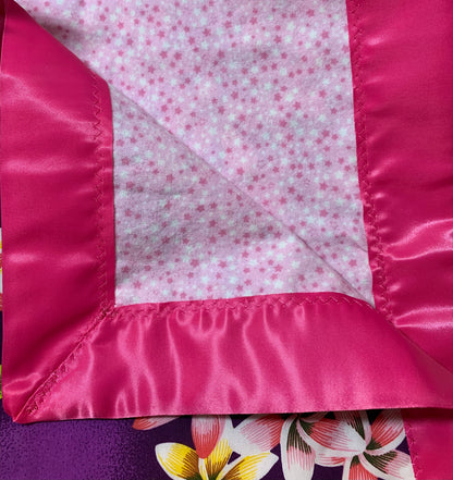 100% cotton Aloha print purple and bubble gum pink satin trim baby blanket